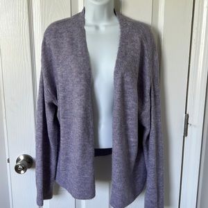 Loose fitting lavender cardigan.
